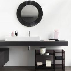 Counter top washbasin, washtop, circle mirror and rack. 