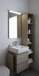 Washbasin and vanity unit with drawers and towel rail with tall unit. 
