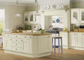 Oak worktops with feature island and glass and wood fronts. 